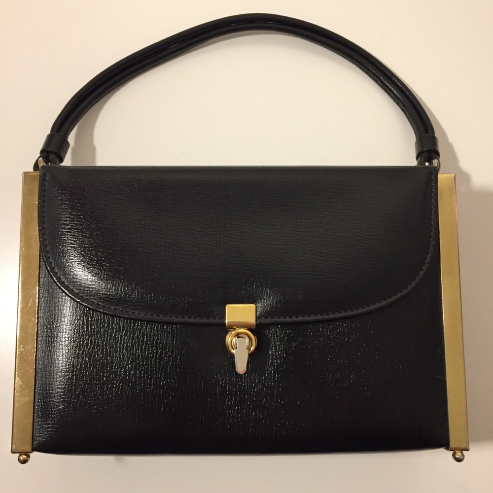 Etra handbag.  Black leather with gold tone trim.